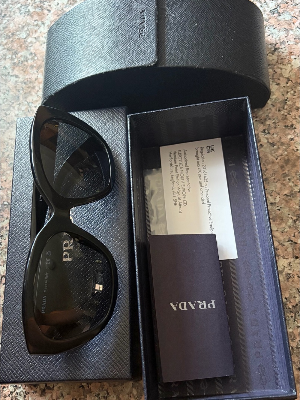 Prada Black Women's Cat-Eye Sunglasses with Dark Lenses